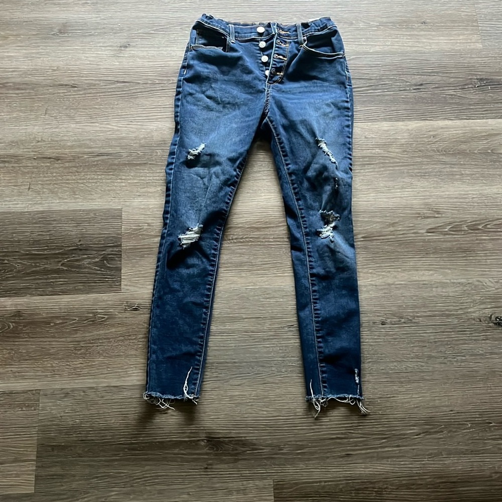 Girls Old Navy High Rise Rockstar Super Skinny Jeggings with raw hem.